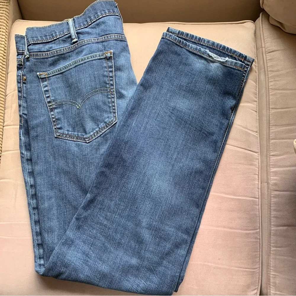 LEVIS.‎ Jeans, five pockets. Fraying on hem, and distressed W38/L34. Zipp…